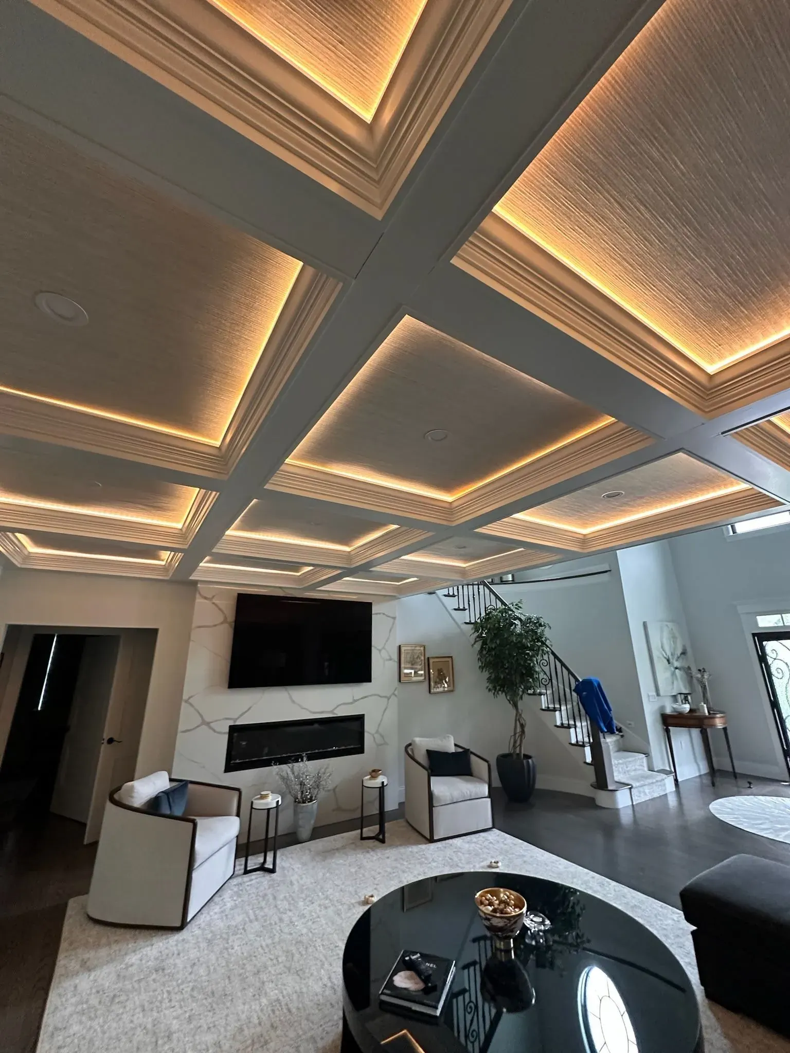 Coffered ceiling with LED cove lighting in a great room